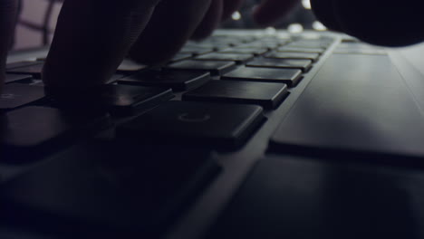 man hands typing on laptop keyboard. male person working on grey laptop computer