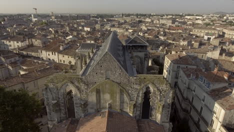 drone back view of saint roch church in montpellier, france. early morning