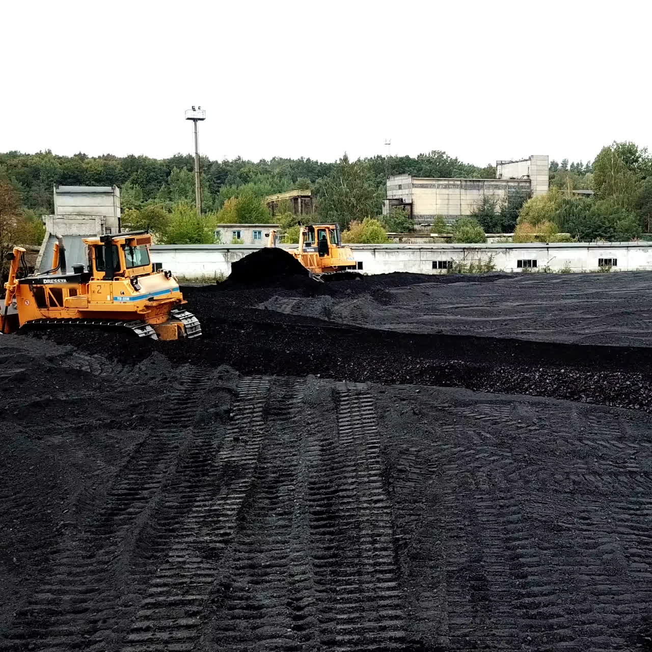 Open pit mine, breed sorting. Mining coal. Bulldozer sorts coal. Extractive industry, anthracite. Coal industry.