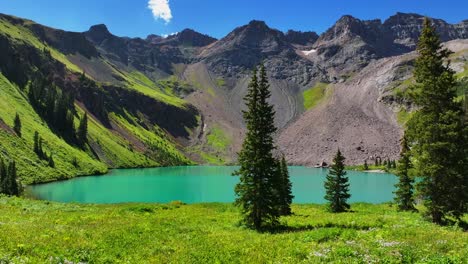 summer hiking trail lower blue lake mount sneffels wilderness ridgway telluride colorado aerial drone san juan rocky mountains uncompahgre national forest sunny morning wildflower bluesky circle right