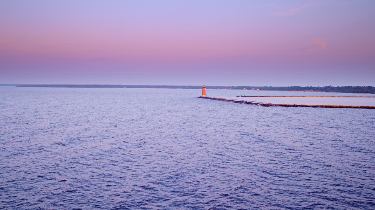 Drone shot flying towards breakwater
