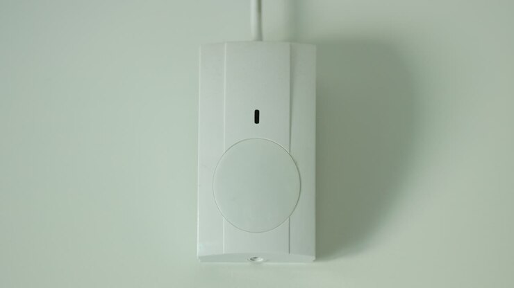 The motion sensor alarm is triggered. The red LED on the sensor lights up