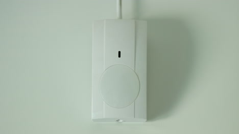 The-motion-sensor-alarm-is-triggered.-The-red-LED-on-the-sensor-lights-up