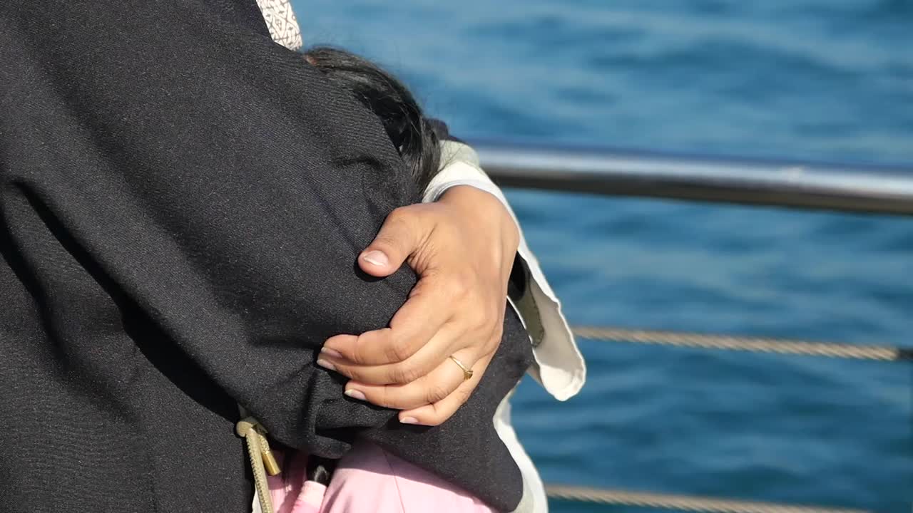 Affectionate embrace by the sea