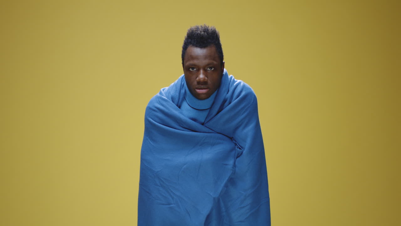 Man Wrapped in Blanket