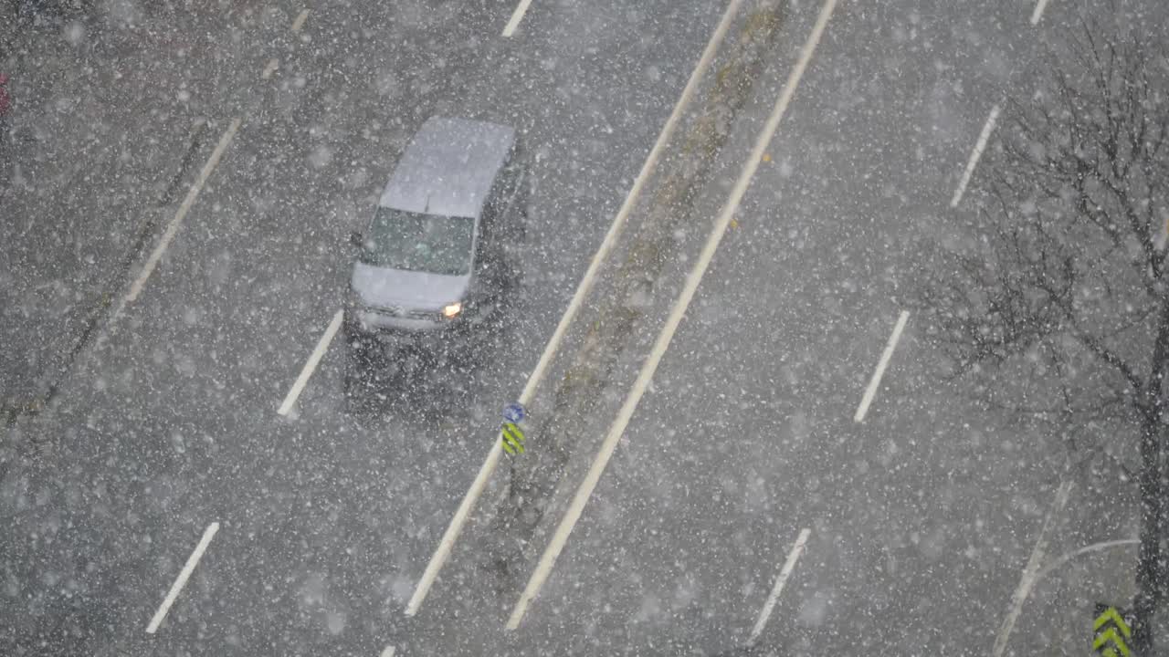 Snowy City Street with Traffic