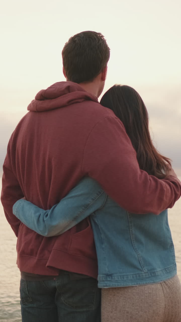 Couple embracing at sunset