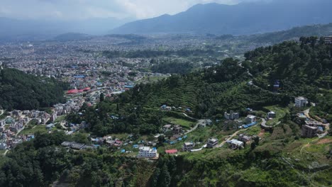 aerial drone footage of kathmandu, nepal’s capital, showcases city life, historic architecture, and scenic skies filled with white clouds offering a peaceful contrast to the dense urban landscape
