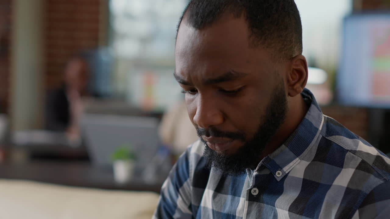 Male employee working on startup review to plan development