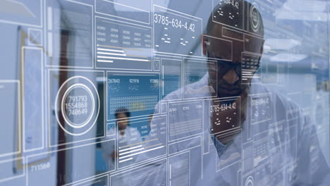 animation of data processing over african american male scientist using tablet