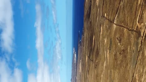 vertical drone shot dry and arid land in middle of nowhere in desert