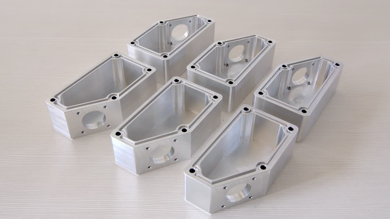 Finished metal pieces are taken one by one from the work table