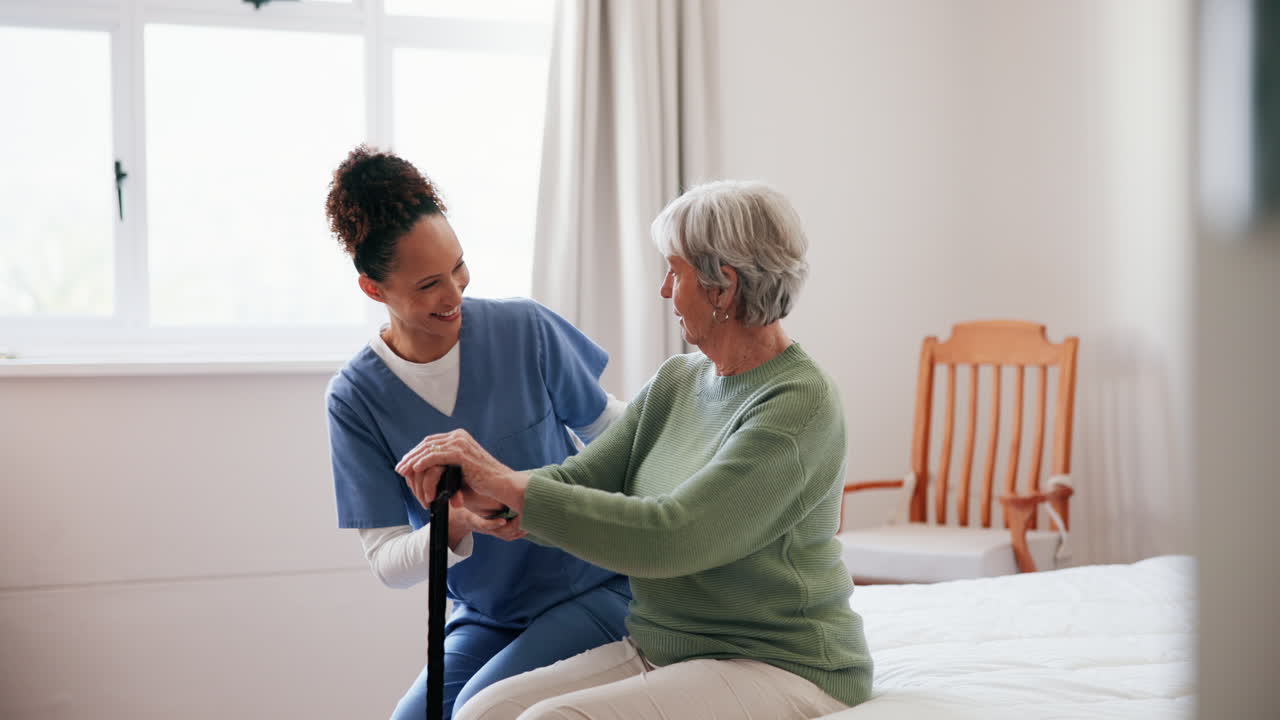 Caregiver assisting senior woman at home