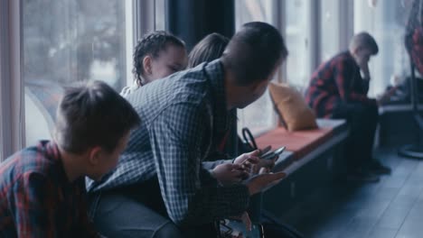 children waiting by a window