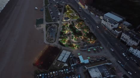 aerial view of a miniature golf course on the beach at night