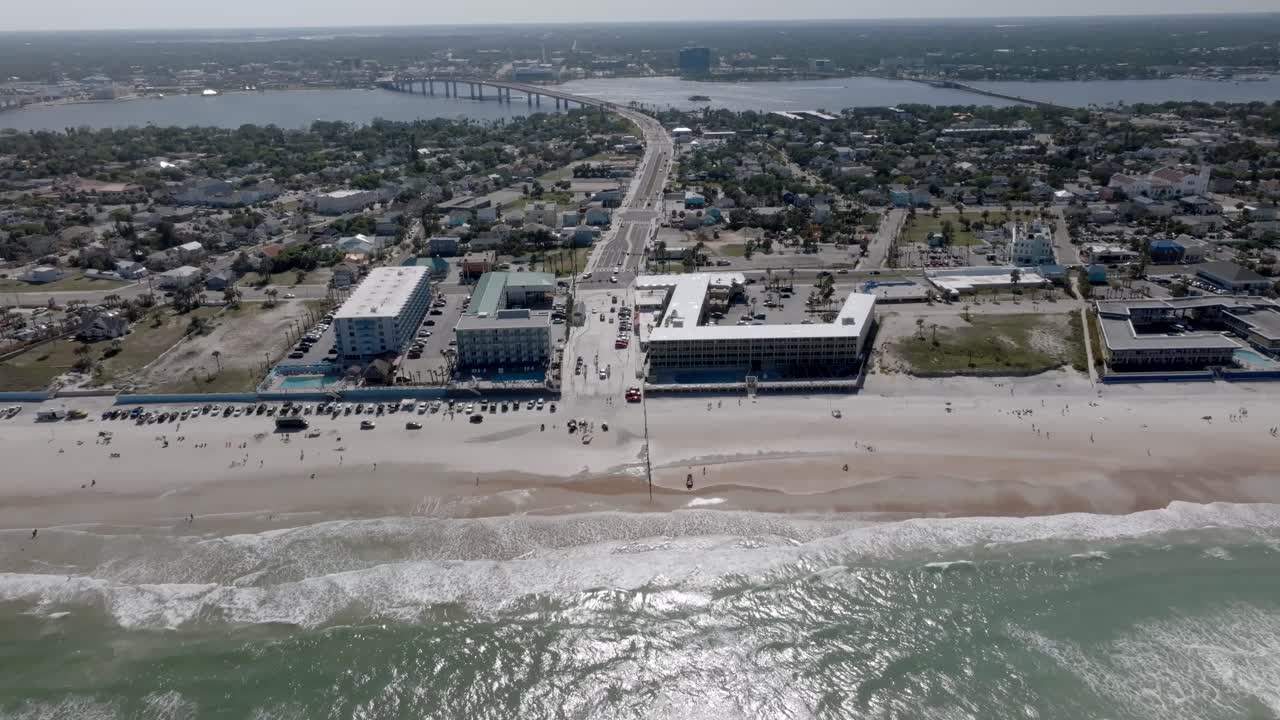 Daytona Beach, Florida with waves from the Atlantic Ocean and stable drone video.