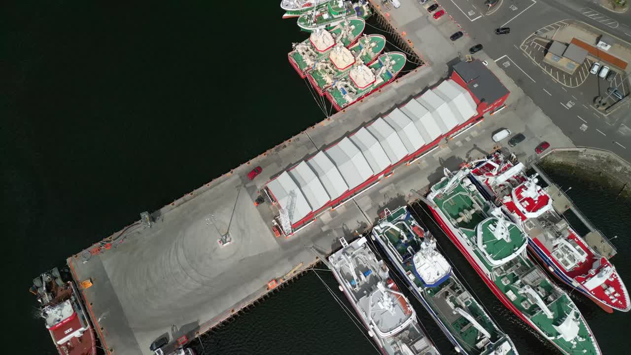 Side-on reversing aerial video of Killybegs Harbour on the Wild Atlantic Way in County Donegal, Ireland. Filmed in 4K, 60FPS and with Rec709 color.