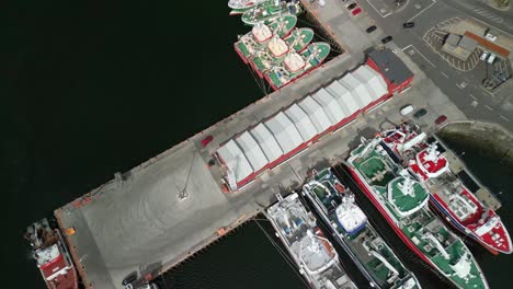 side-on reversing aerial video of killybegs harbour on the wild atlantic way in county donegal, ireland. filmed in 4k, 60fps and with rec709 color.