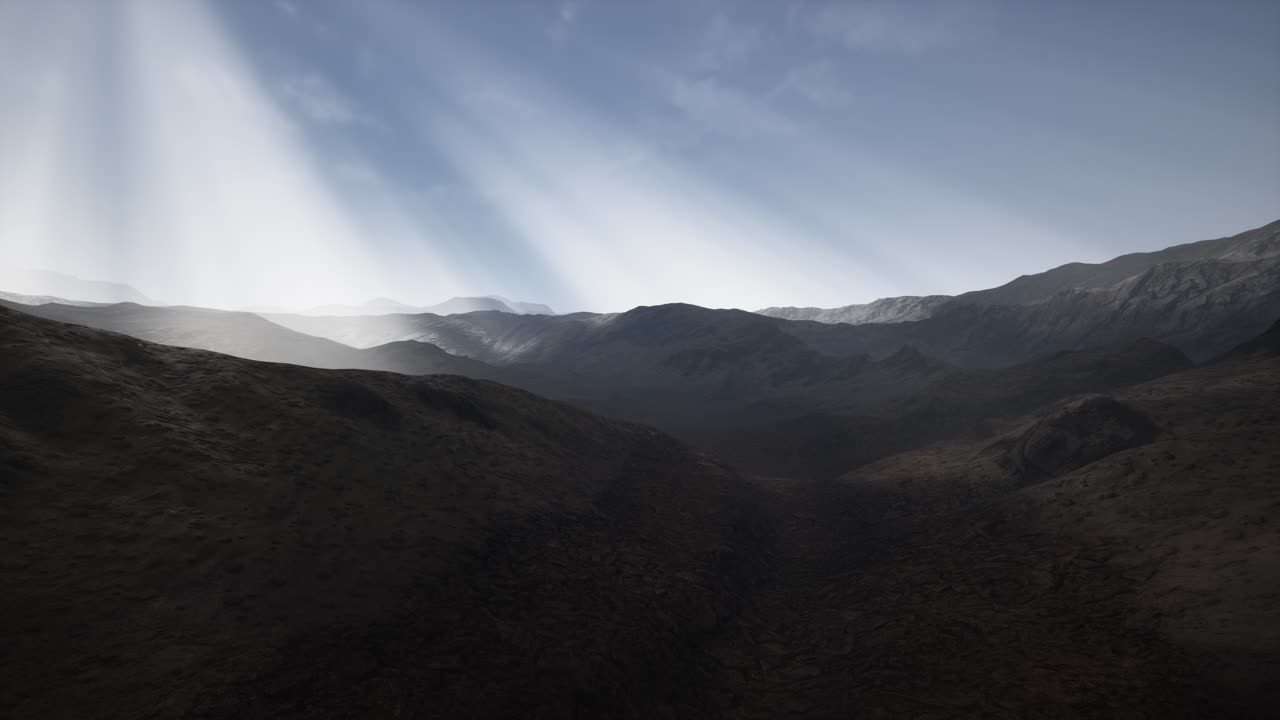 Sun Rays over Mountains in a Valley
