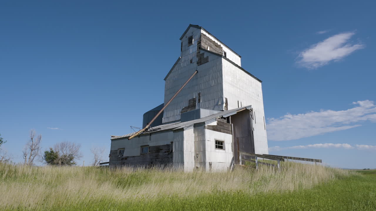 Old Abandoned Grain Elevator in a Field