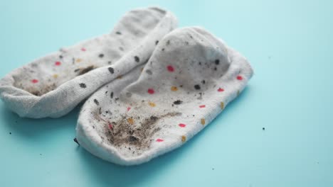 a pair of dirty socks on a blue background