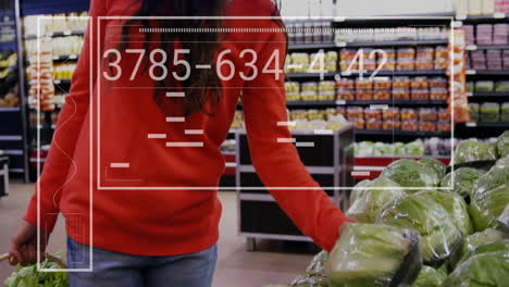 animation of data processing and diagrams over caucasian woman picking vegetables in shop