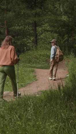 people hiking in the forest