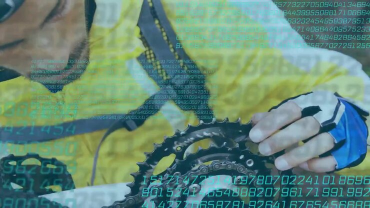 Cyclist inspecting chain, nudging chain across rings to test engagement while scrolling data