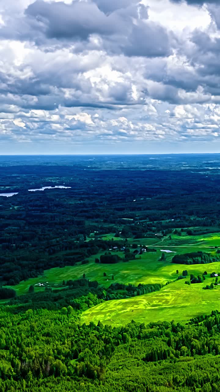 Timelapse of lush green landscape under dramatic cloudy skies