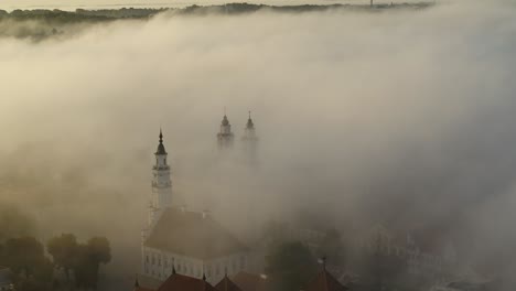 fog over kaunas old town, lithuania