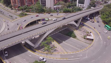 Slow-revealing-aerial-shot-of-city-centre-of-Medellin-and-Aguacatala-roundabout-in-Colombia