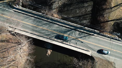 sediments passing under a vehicular bridge in an aerial shot