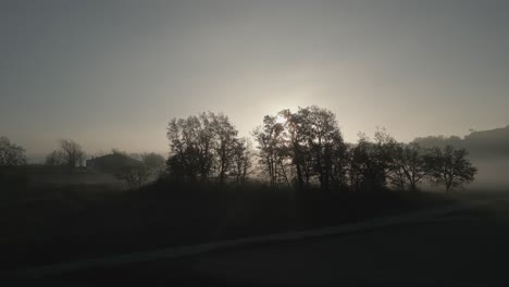 countryside landscape with fog and mist, aerial drone push in - vic, barcelona, catalonia