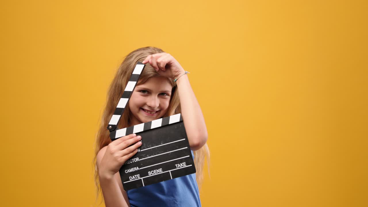 Girl with clapperboard
