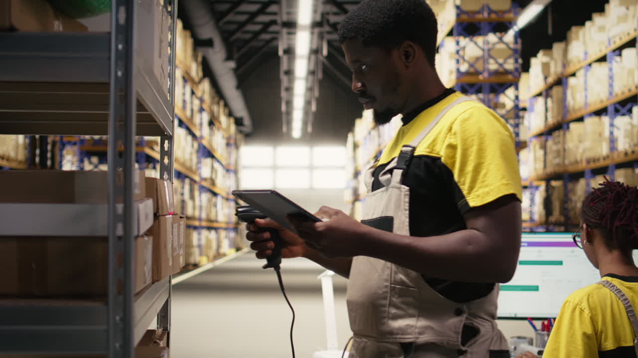 African american e-commerce worker scanning shipping labels numbers