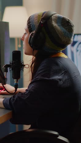 young woman streaming or podcasting from home gaming setup