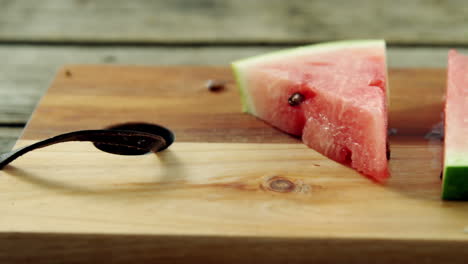 slices of watermelon arranged on chopping board