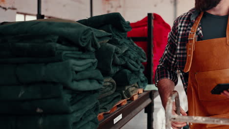 textile, leather workshop and man at shelf