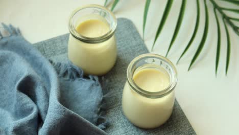 Caramel-pudding-in-a-glass-jar-on-table