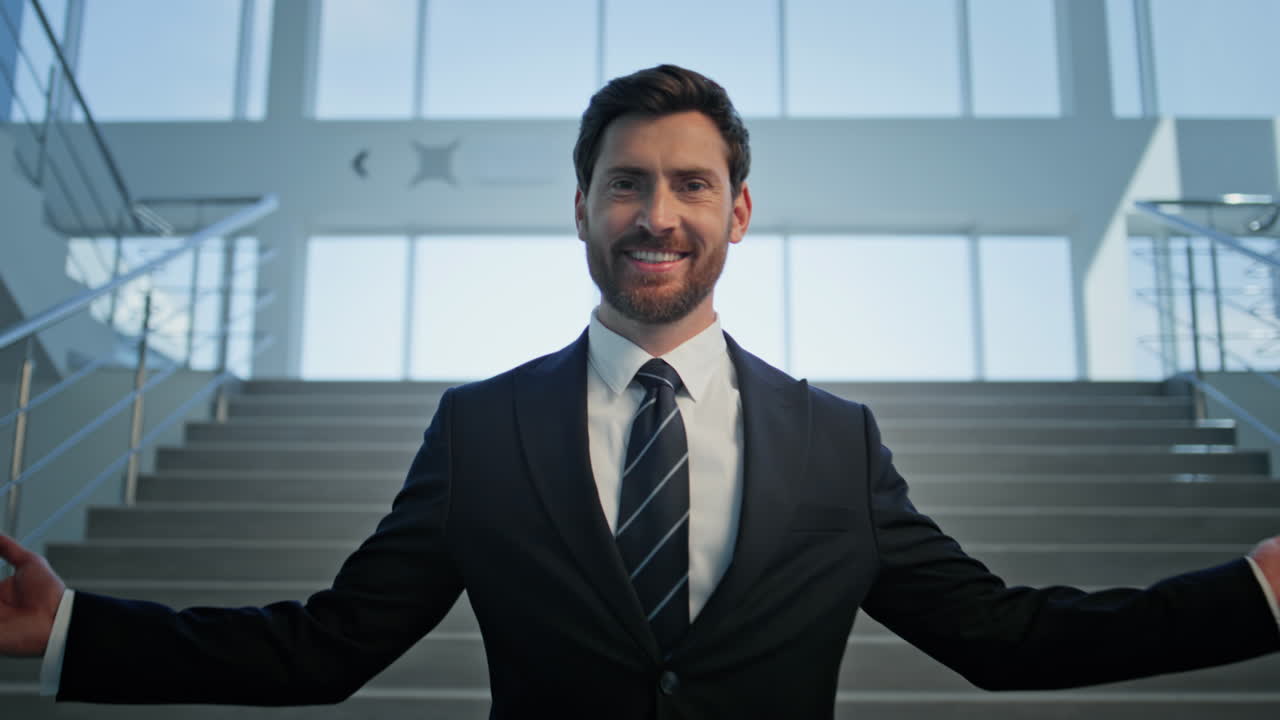 Business owner welcoming office building smiling friendly closeup zoom in