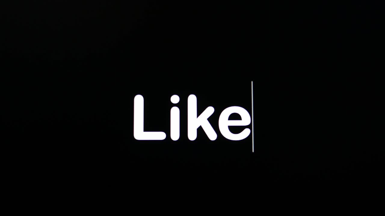 Texto escrito em tela preta com a palavra 'like' em branco