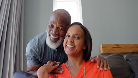 Front-view-of-mature-black-couple-looking-at-camera-in-a-comfortable-home-4k