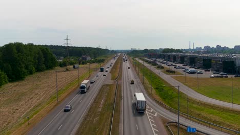 cars driving on a1 highway road near kaunas city, aerial view