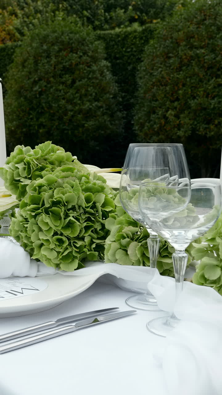 Elegant Table Setting with Hydrangeas and Wine Glasses