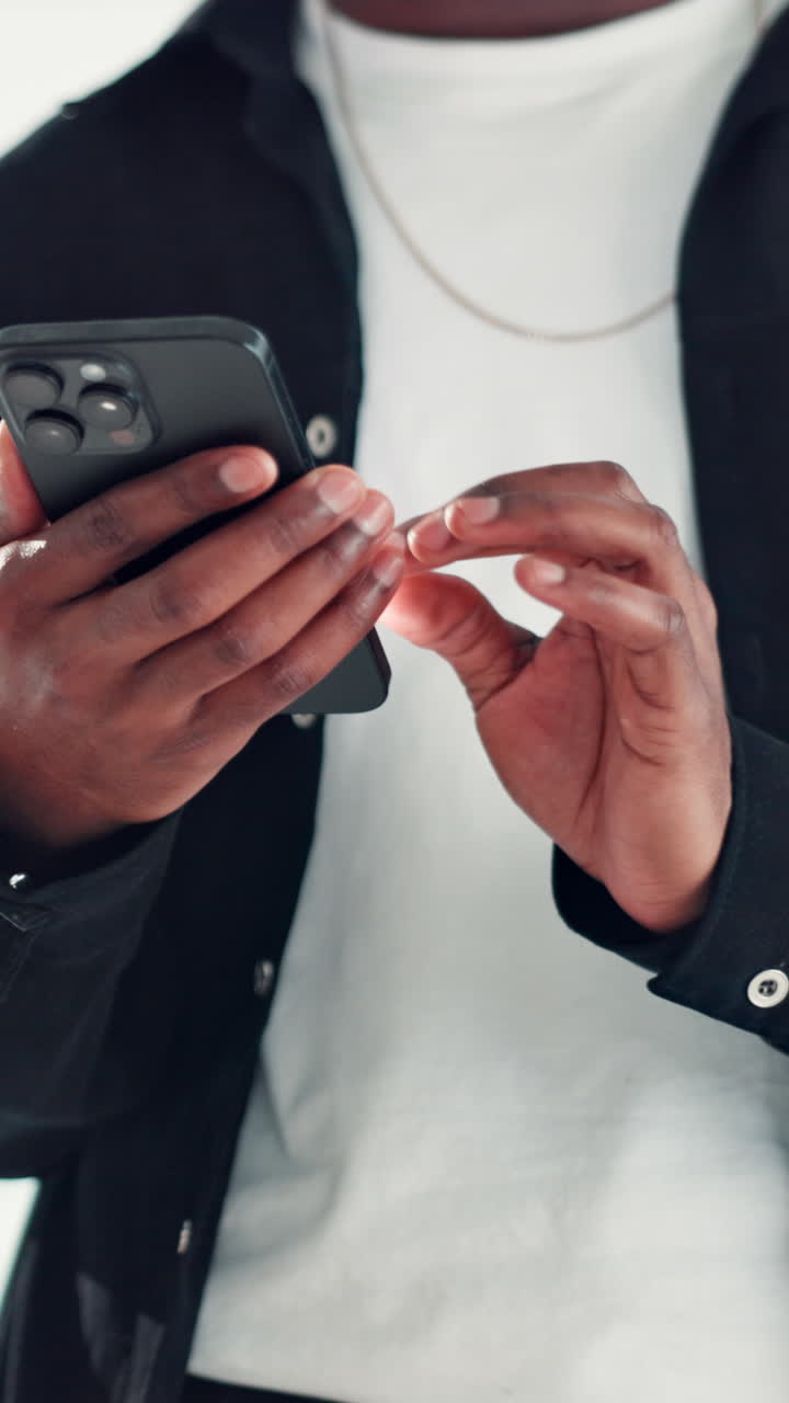 Close-Up of Person's Hands Typing on a Smartphone Screen