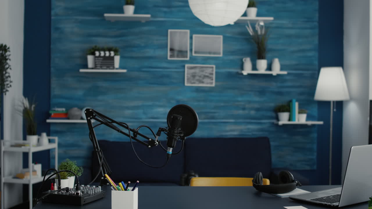 Empty home studio desk with professional audio equipment on table