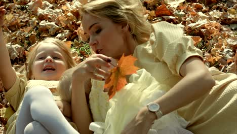 happy family mother and children in autumn park