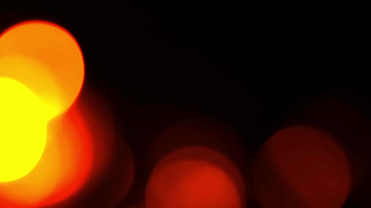 Abstract Background of Glowing Red and Orange Bokeh Lights