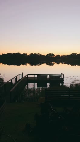 sunset on the lake with dock