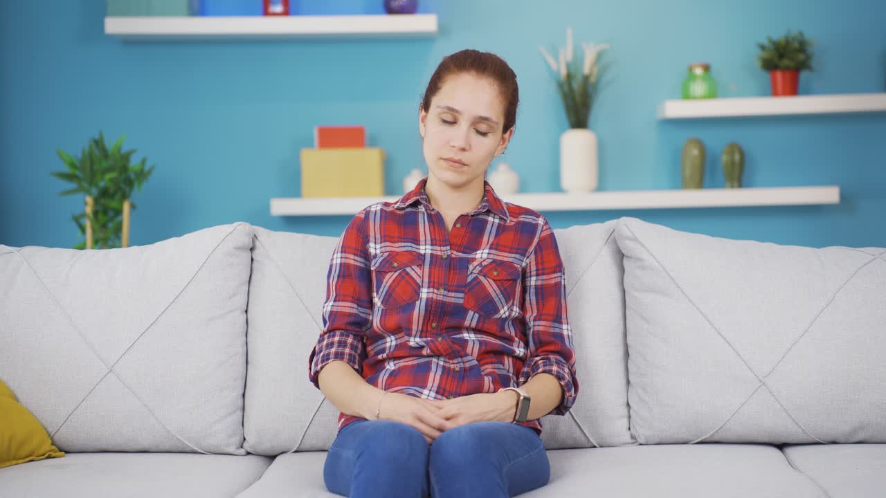 Young woman experiencing sudden movement dizziness.